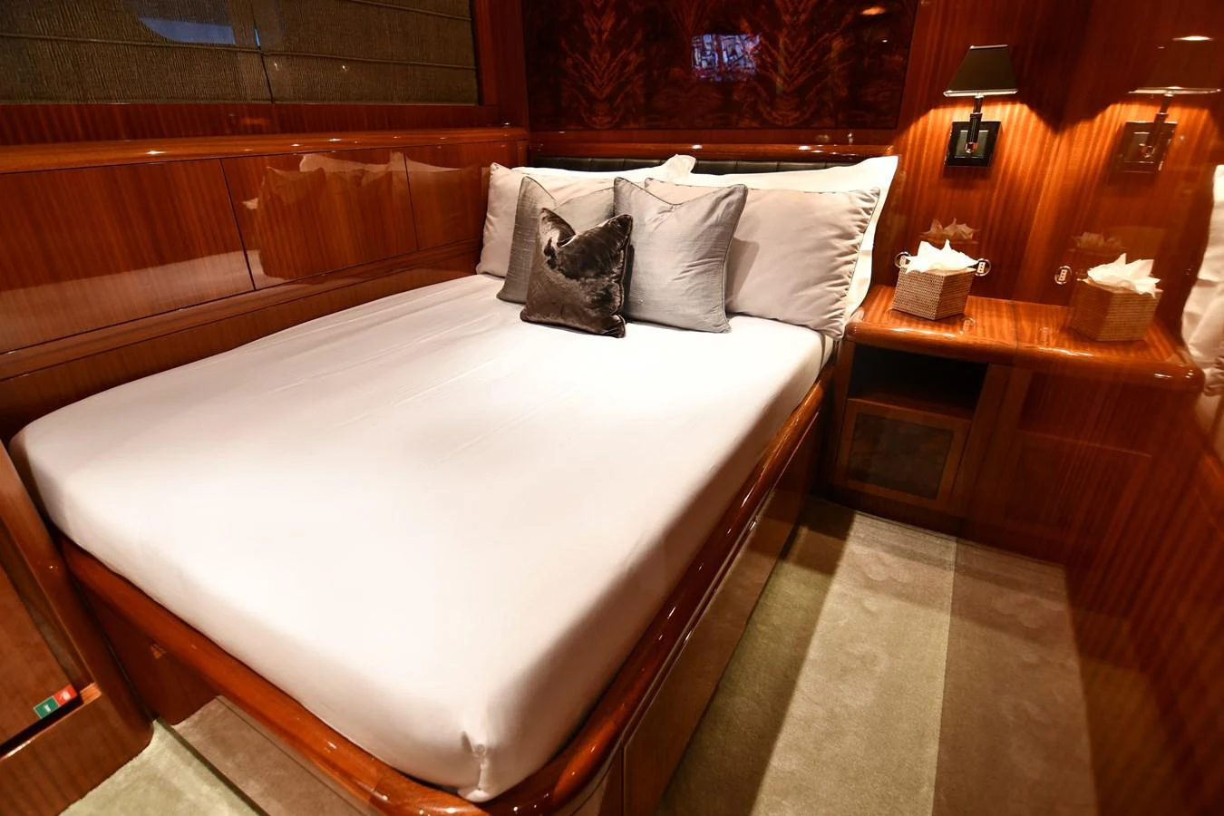 a bed with white sheets aboard OSE Yacht for Sale