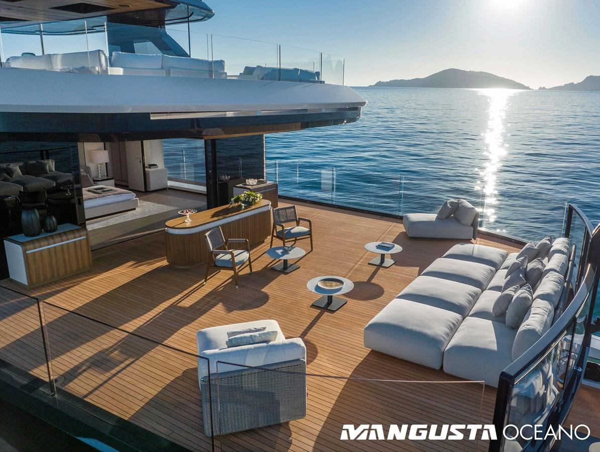 a room with a couch and a table and a large body of water aboard EVA4EVA Yacht for Sale