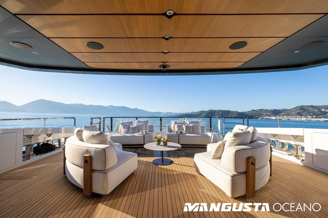 a room with a couch and a table and a view of the water aboard EVA4EVA Yacht for Sale