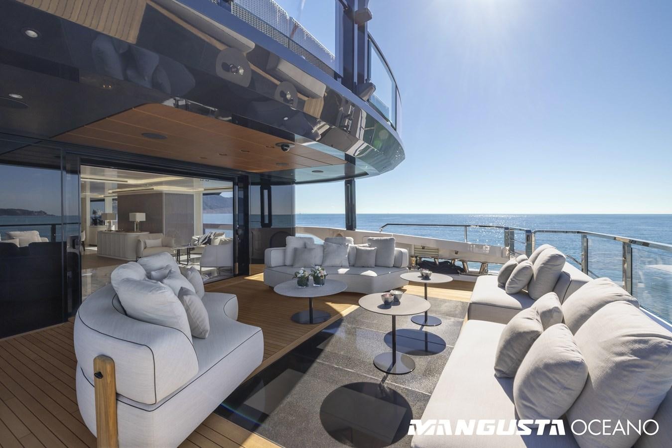 a living room with a large balcony aboard EVA4EVA Yacht for Sale