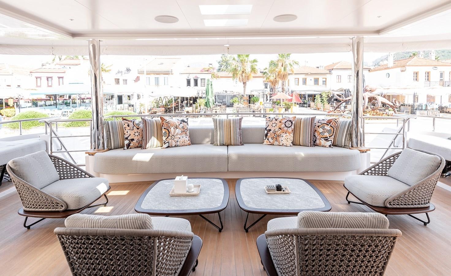 a living room with a large window aboard M55 Yacht for Sale