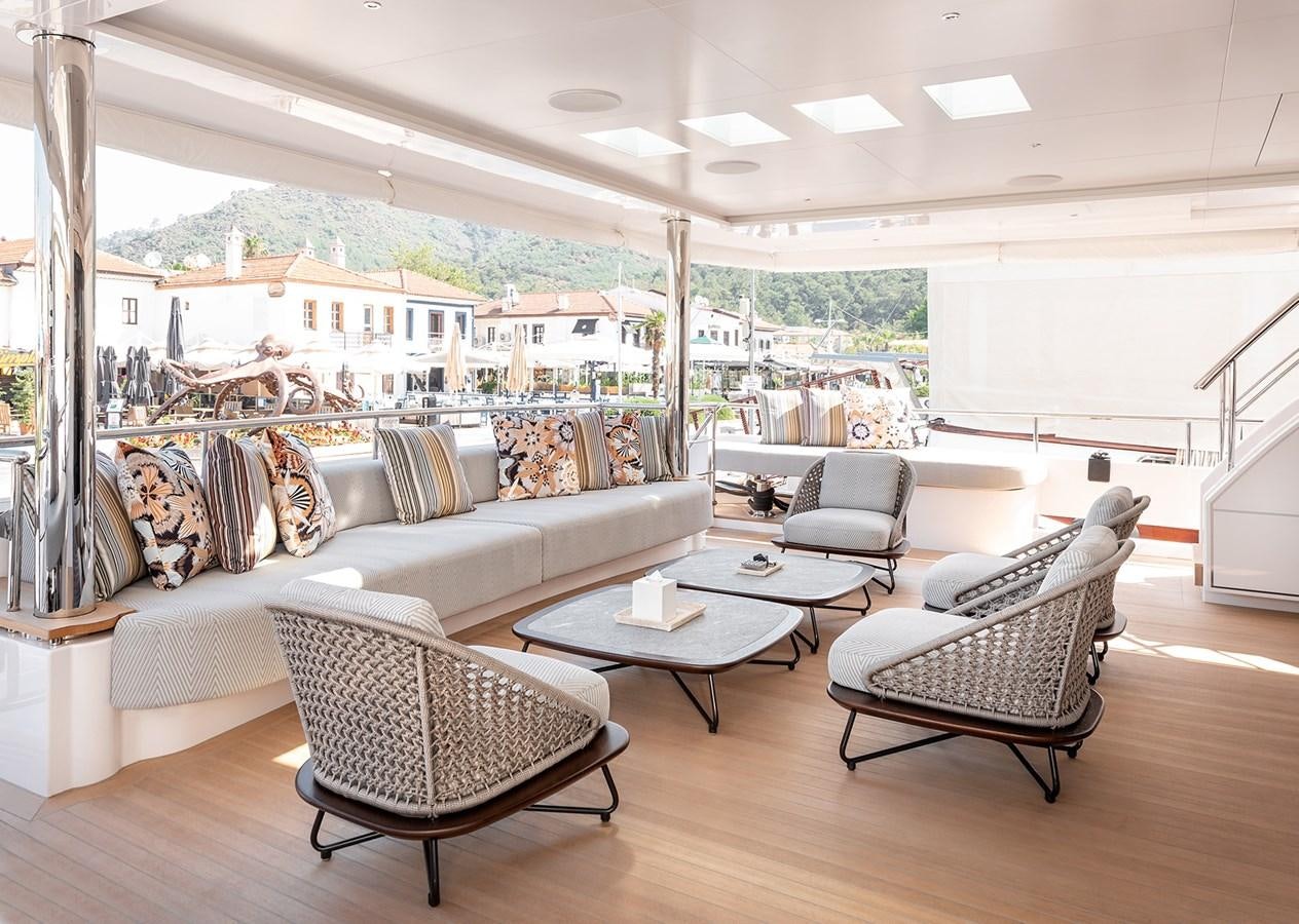 a living room with a large window aboard M55 Yacht for Sale