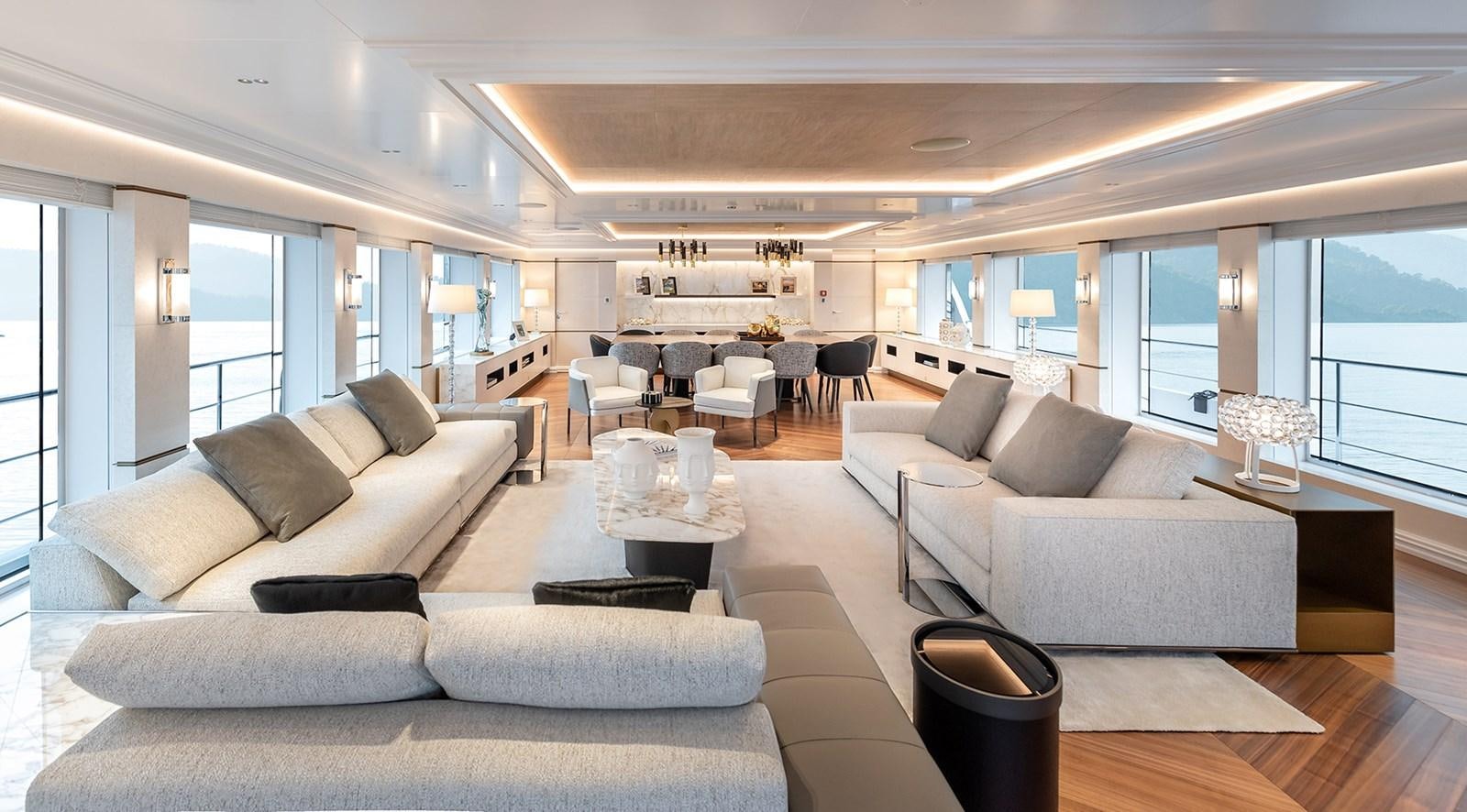 a living room with a large window aboard M55 Yacht for Sale