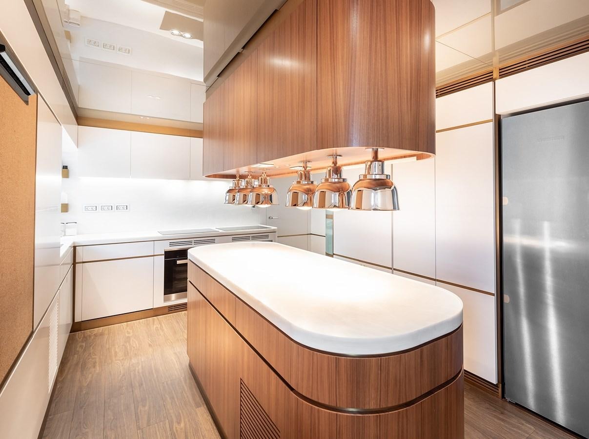 a kitchen with a large island aboard M55 Yacht for Sale