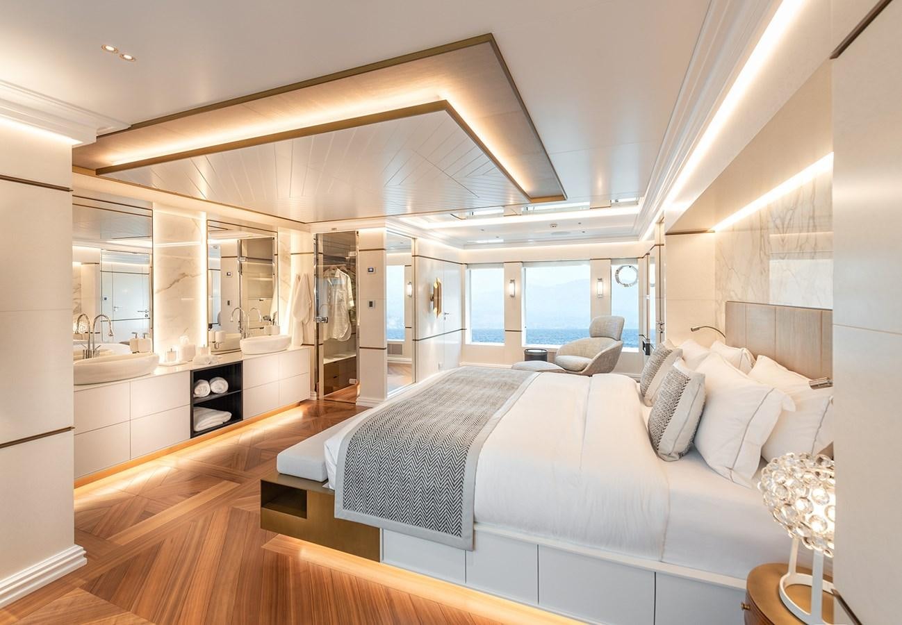 a large bedroom with a large bed aboard M55 Yacht for Sale