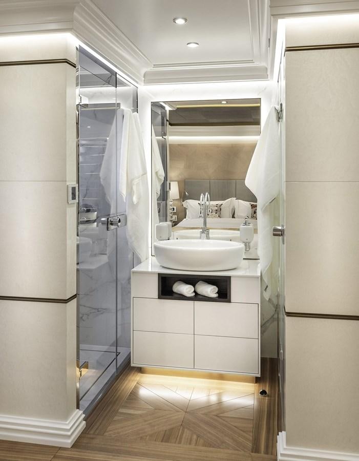 a bathroom with a sink and a shower unit aboard M55 Yacht for Sale