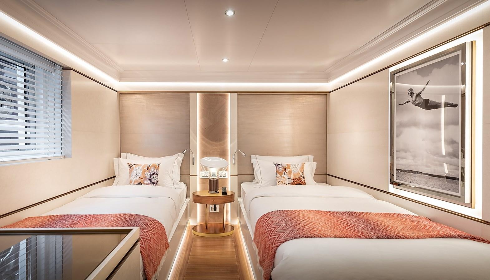 a couple of beds in a hotel room aboard M55 Yacht for Sale
