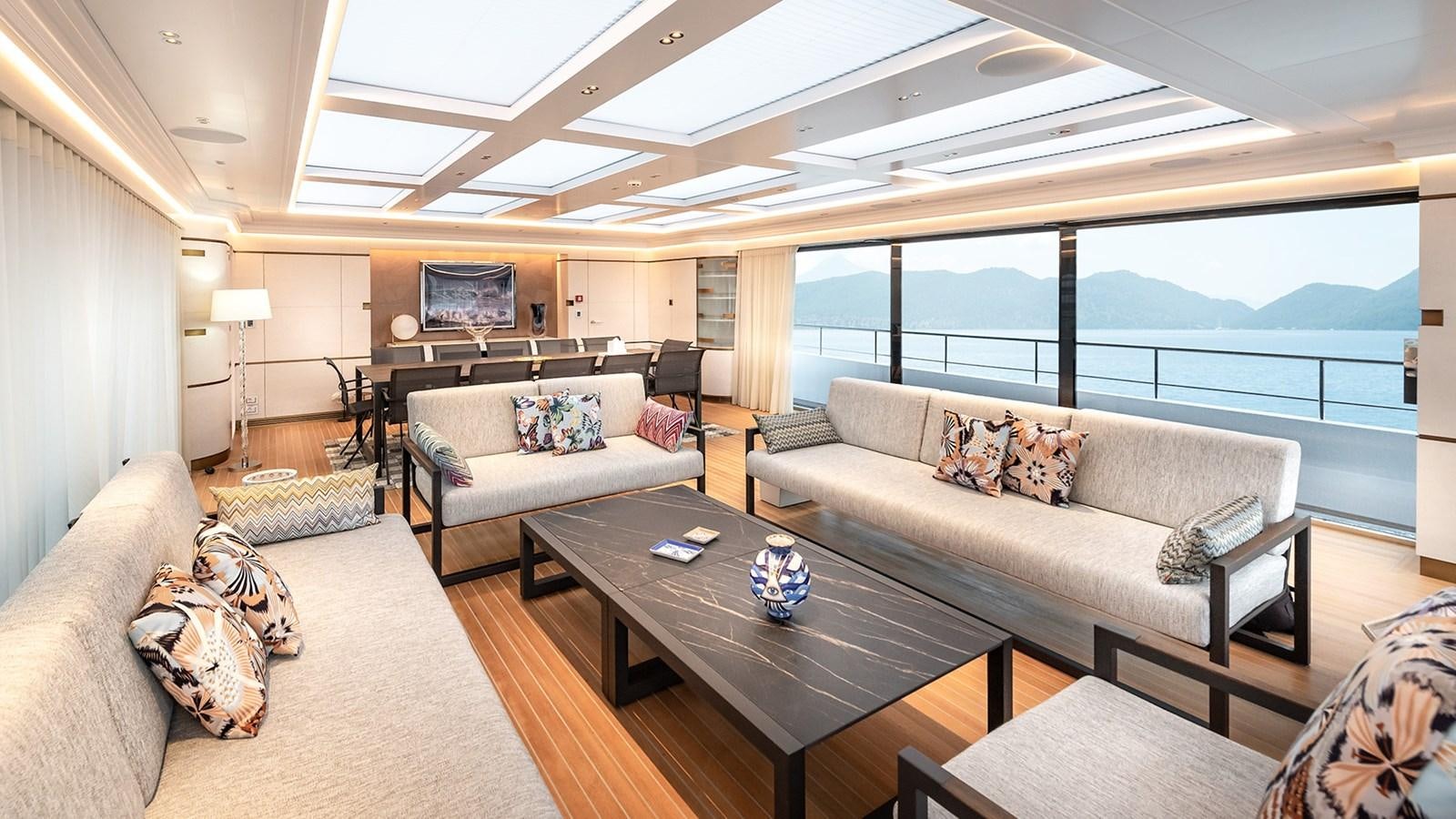 a living room with a large window aboard M55 Yacht for Sale