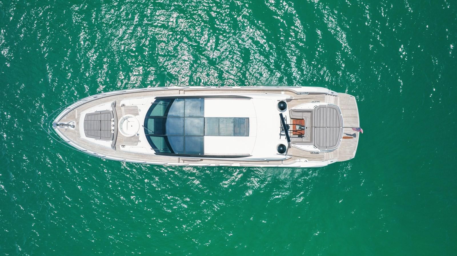 a small white car aboard WOODEVER Yacht for Sale