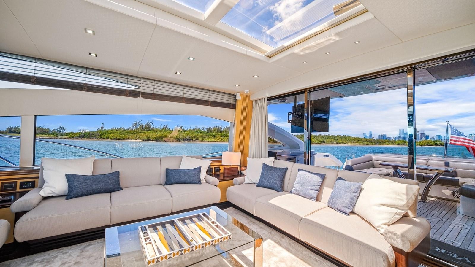 a living room with a large window aboard WOODEVER Yacht for Sale