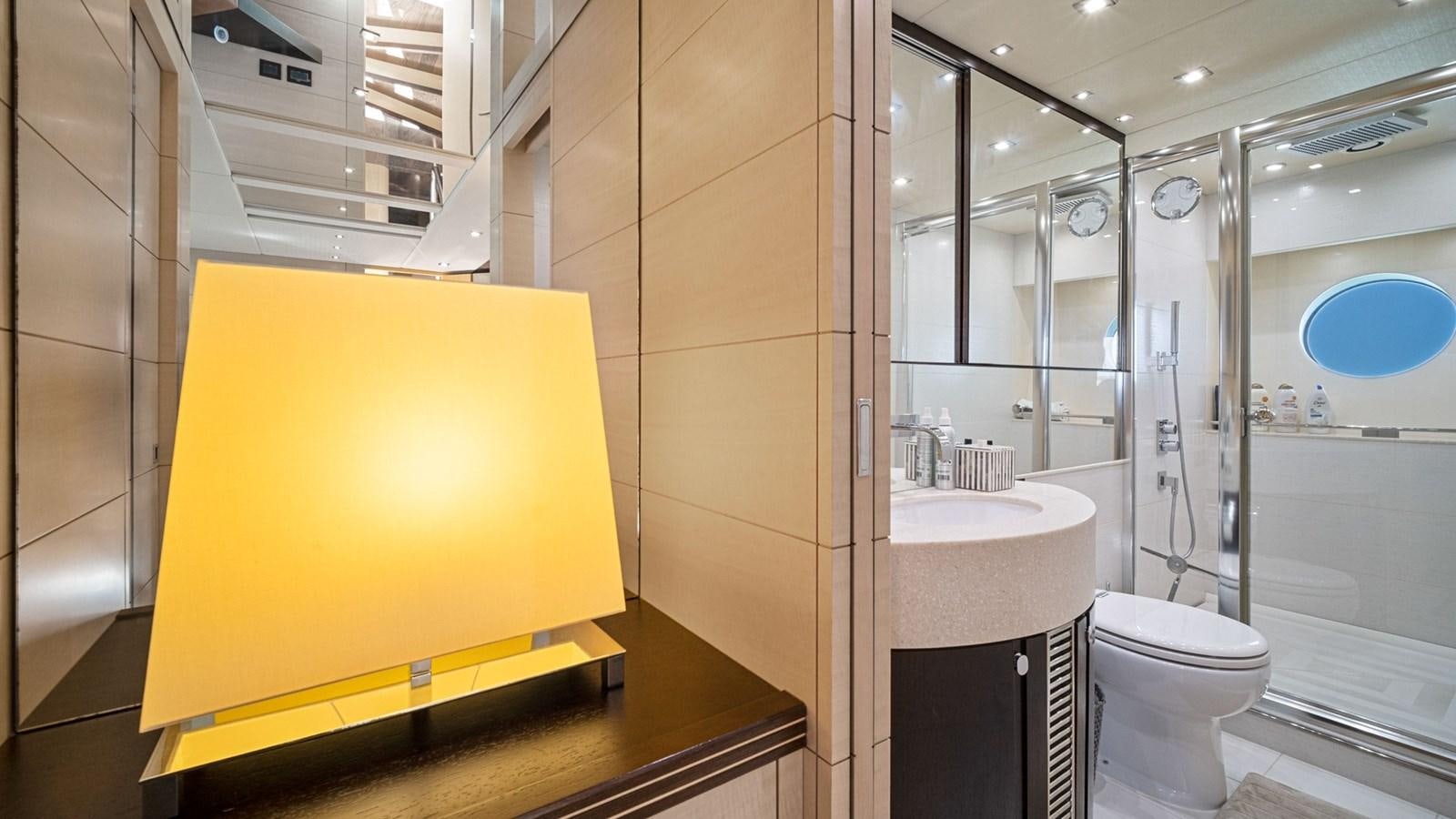 a bathroom with a sink toilet and shower unit aboard WOODEVER Yacht for Sale