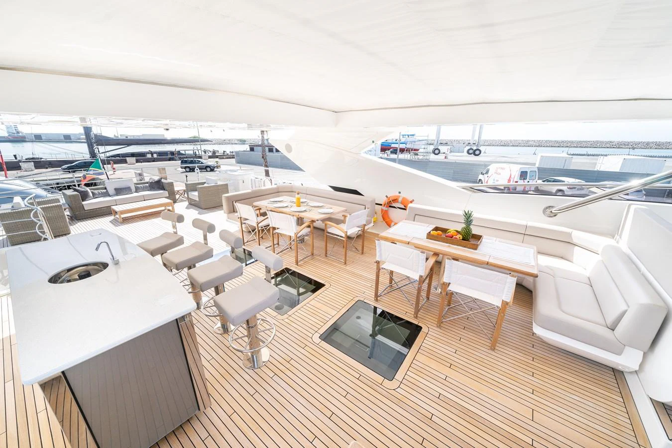 a room with tables chairs and a large body of water aboard SUNSEEKER 116 -  QART HADASHT Yacht for Sale