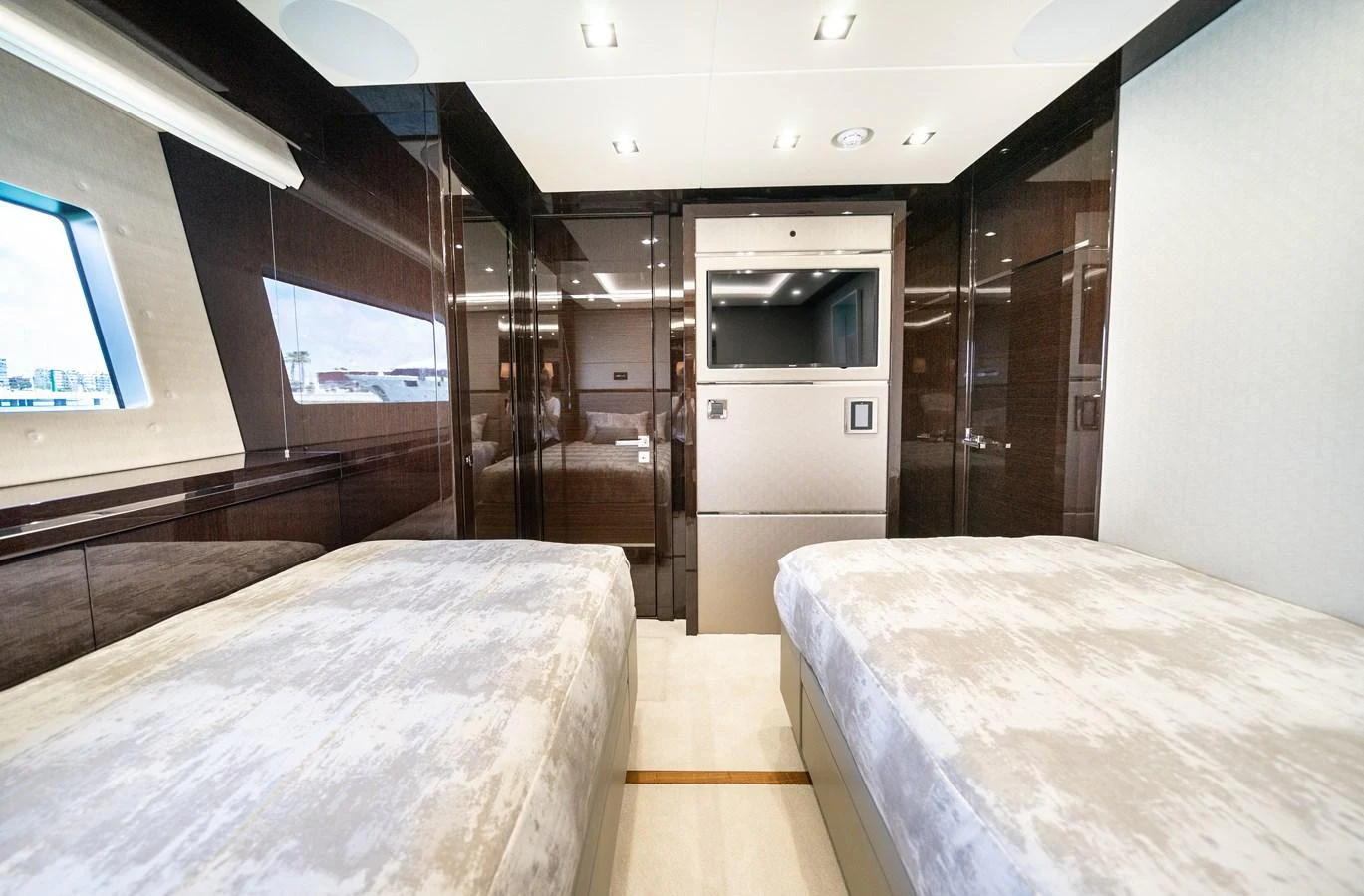 a room with a bed and a tv aboard SUNSEEKER 116 -  QART HADASHT Yacht for Sale
