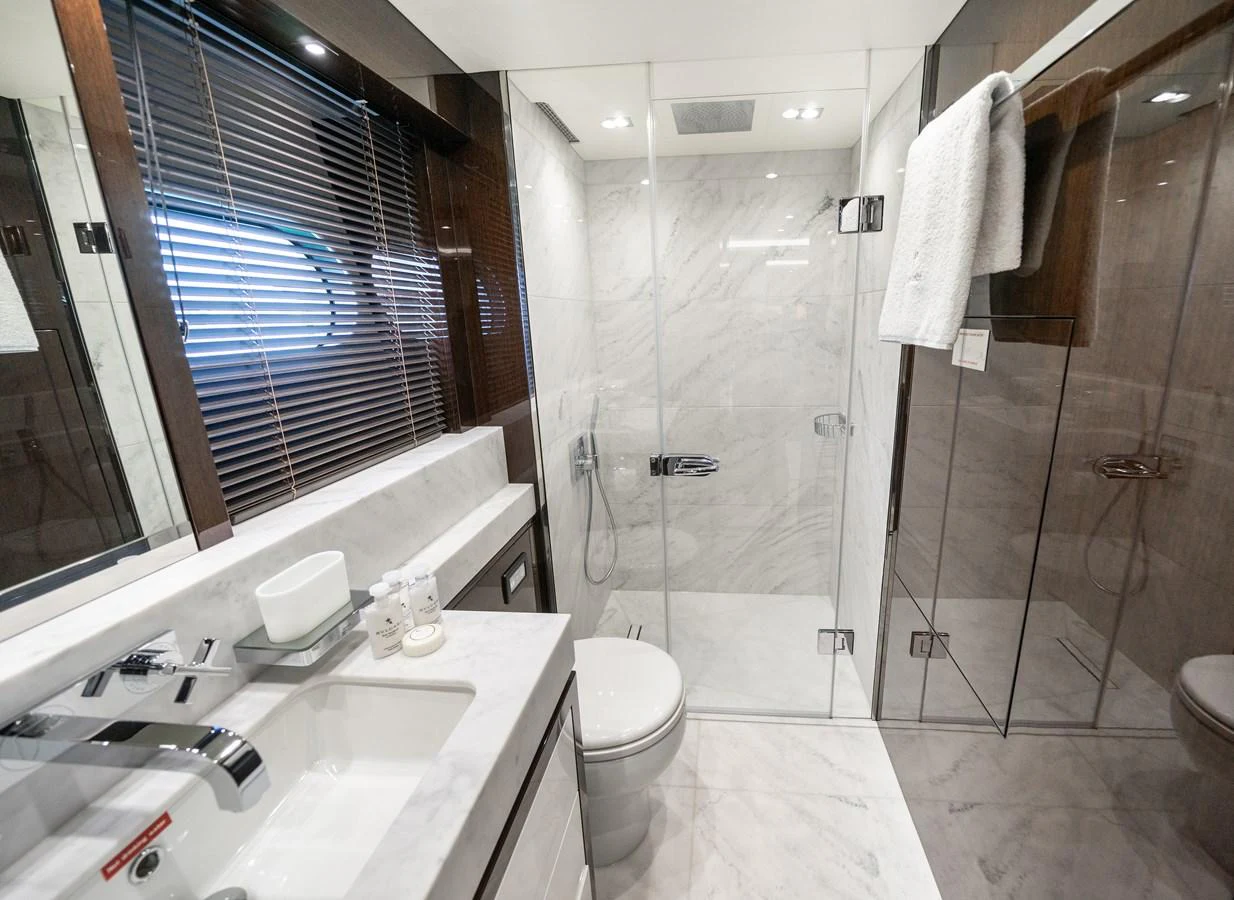 a bathroom with a sink toilet and shower aboard SUNSEEKER 116 -  QART HADASHT Yacht for Sale
