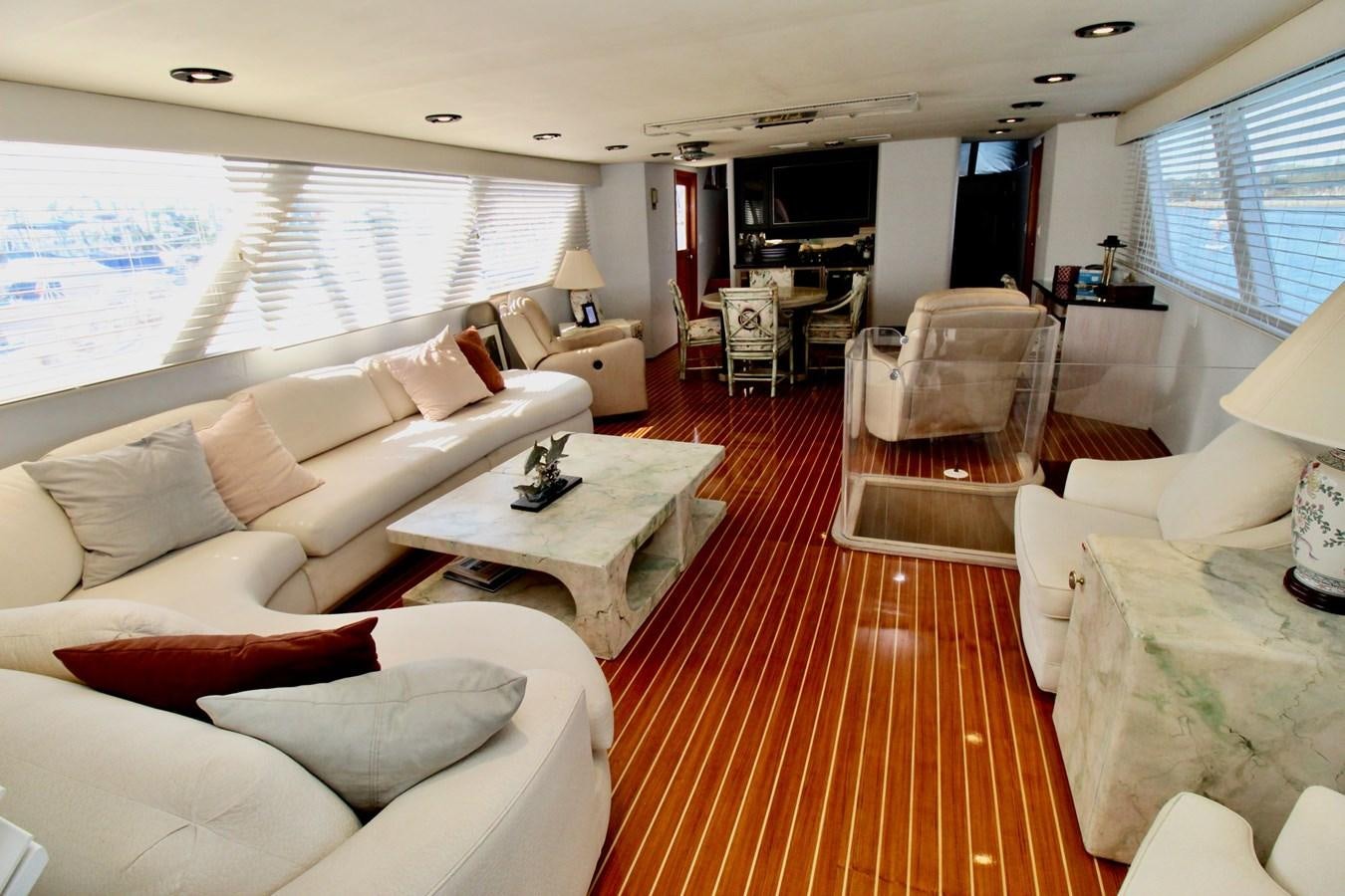 a living room with white couches aboard ROYAL EAGLE II Yacht for Sale