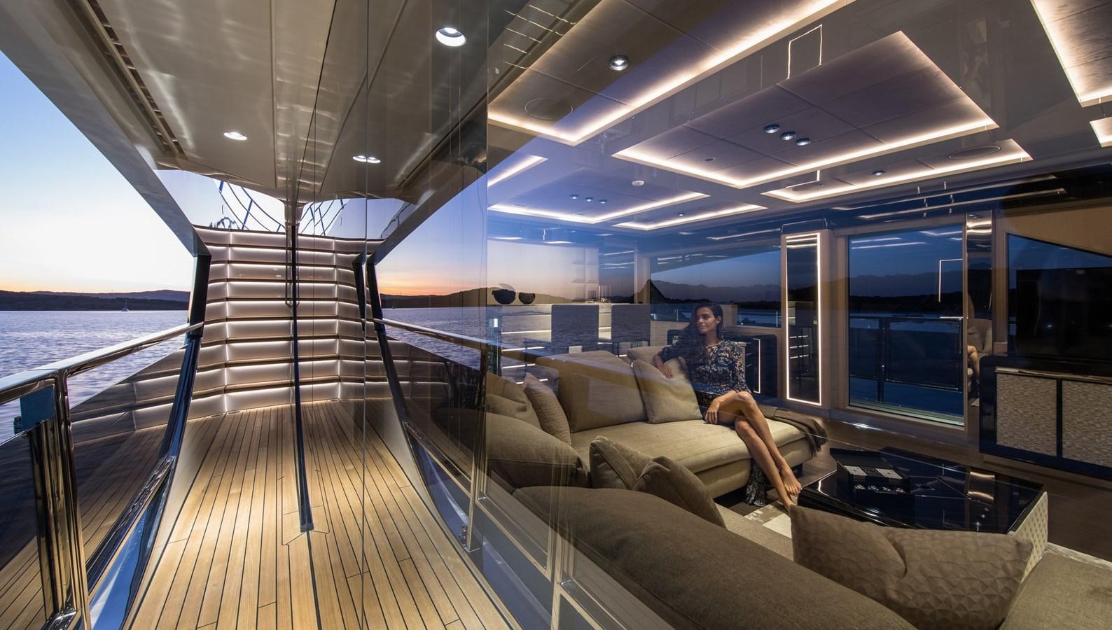 a person sitting on a couch aboard YORAL Yacht for Sale