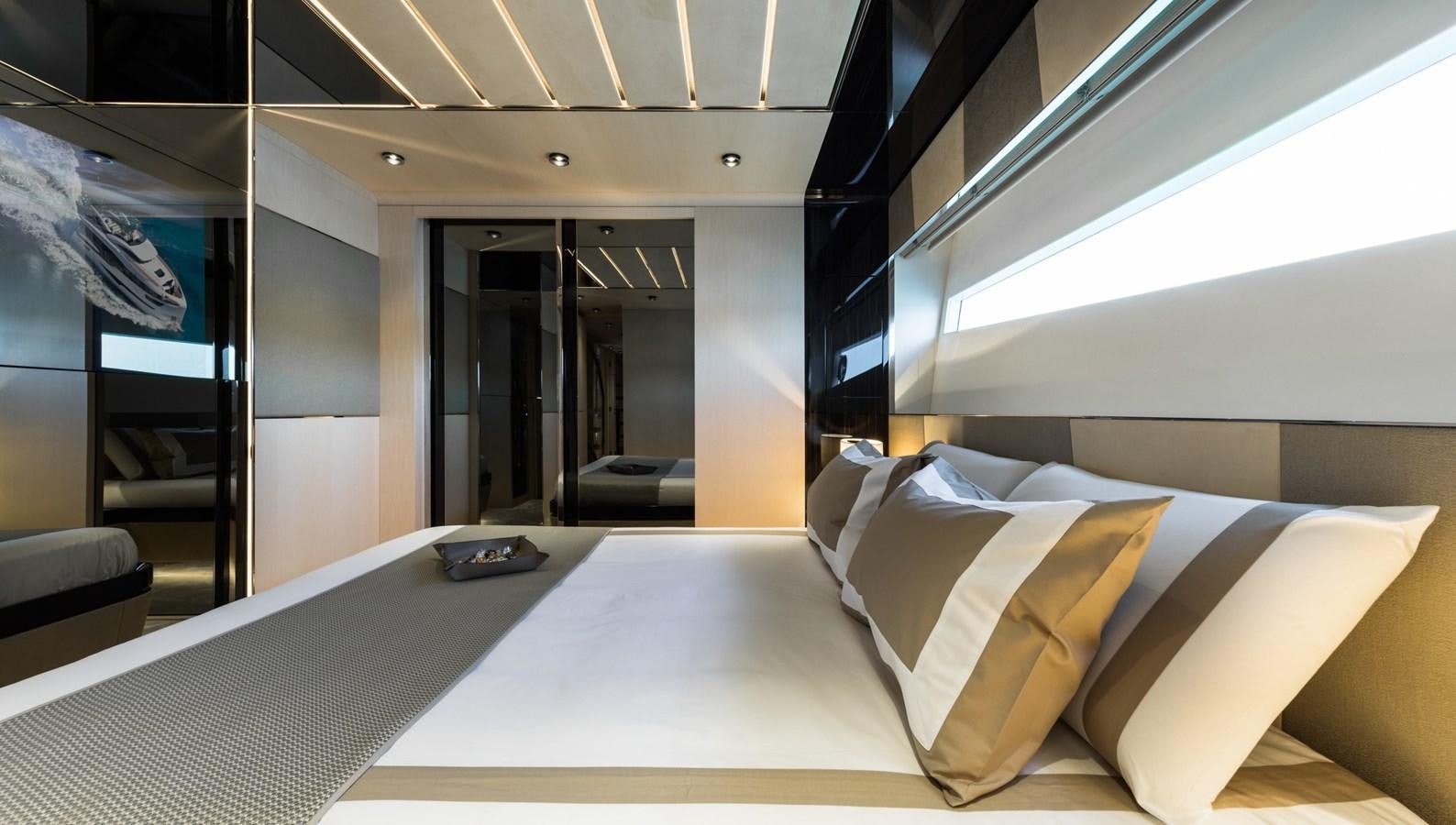 a room with a bed and a laptop on the bed aboard YORAL Yacht for Sale