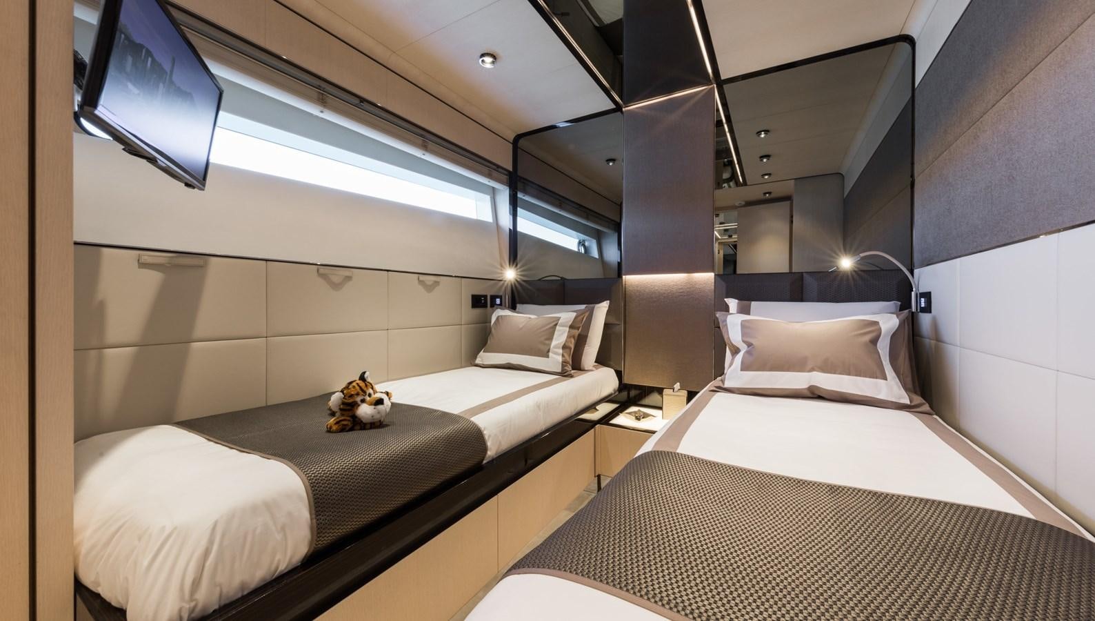 a room with two beds aboard YORAL Yacht for Sale