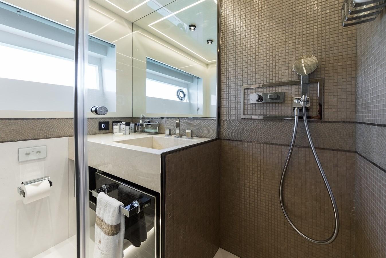 a bathroom with a sink and a mirror aboard YORAL Yacht for Sale
