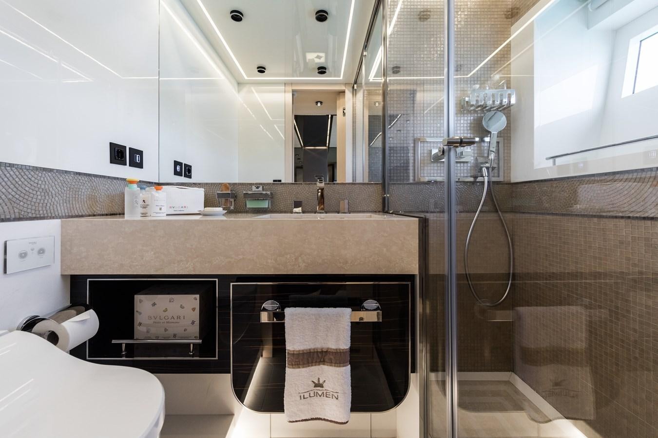 a bathroom with a shower and sink aboard YORAL Yacht for Sale