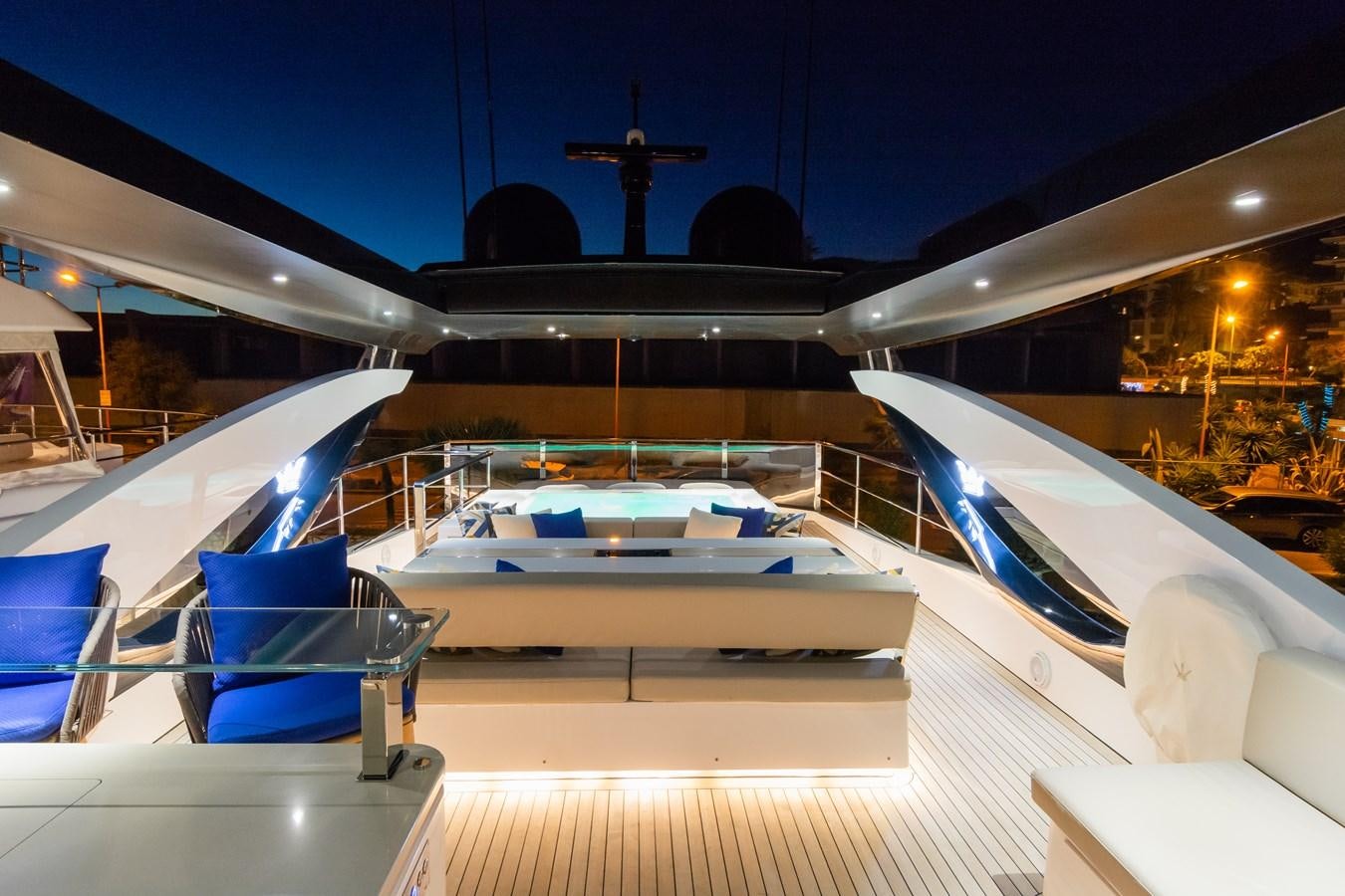 a large ship with a deck and chairs aboard YORAL Yacht for Sale