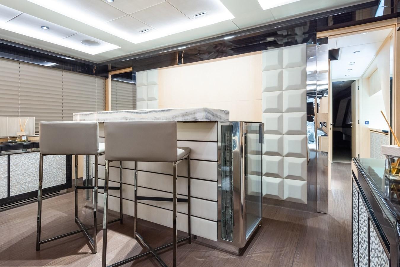 a room with a table and chairs aboard YORAL Yacht for Sale