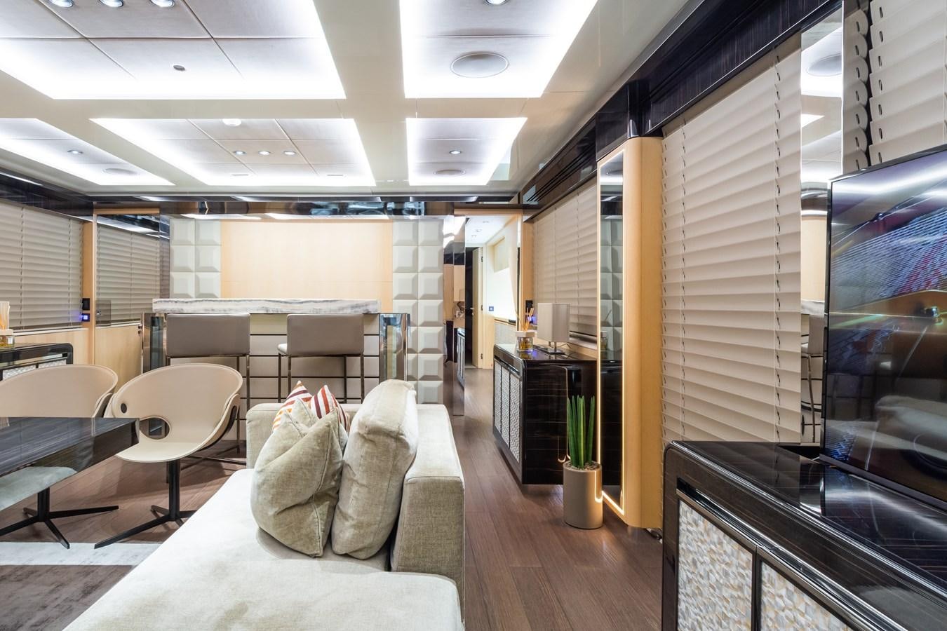 a room with chairs and tables aboard YORAL Yacht for Sale