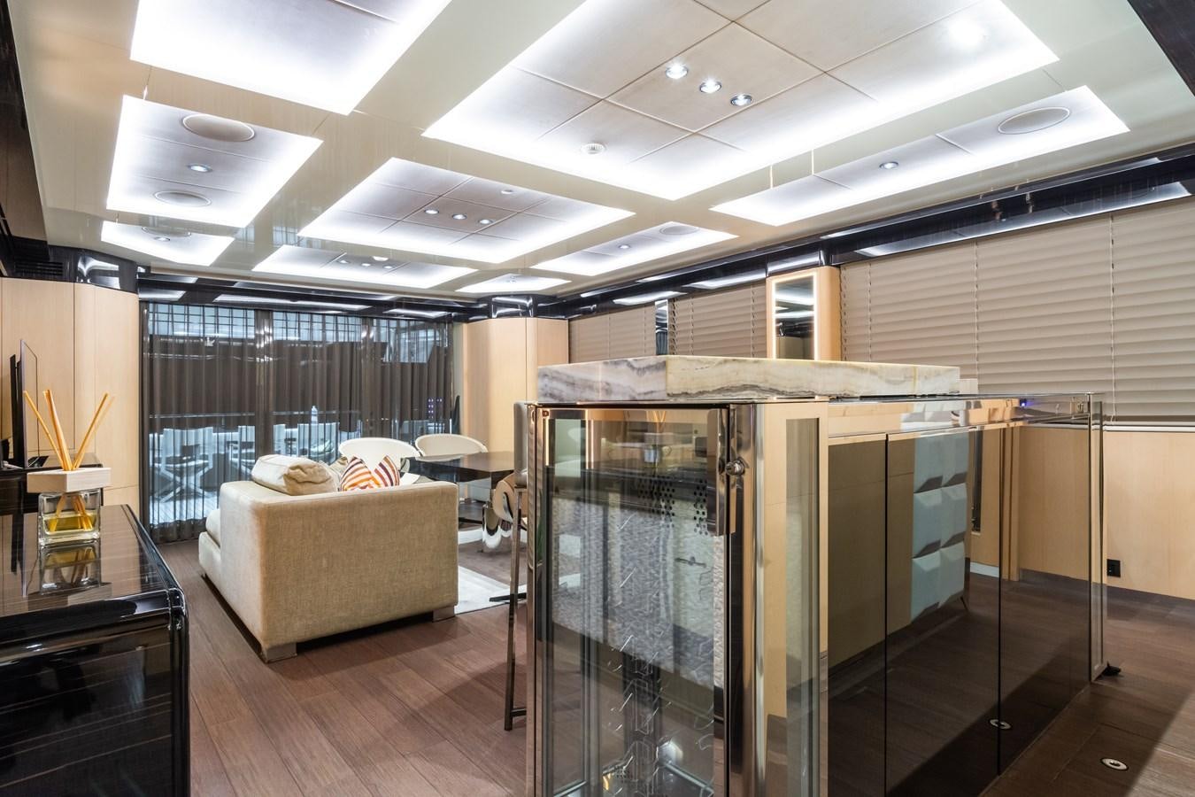 a room with a glass door and a couch and a table aboard YORAL Yacht for Sale