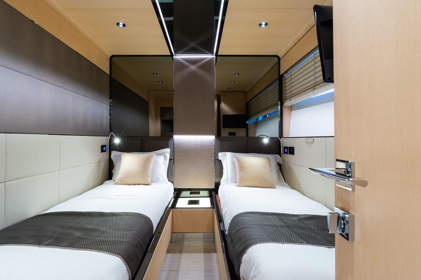a room with two beds aboard YORAL Yacht for Sale
