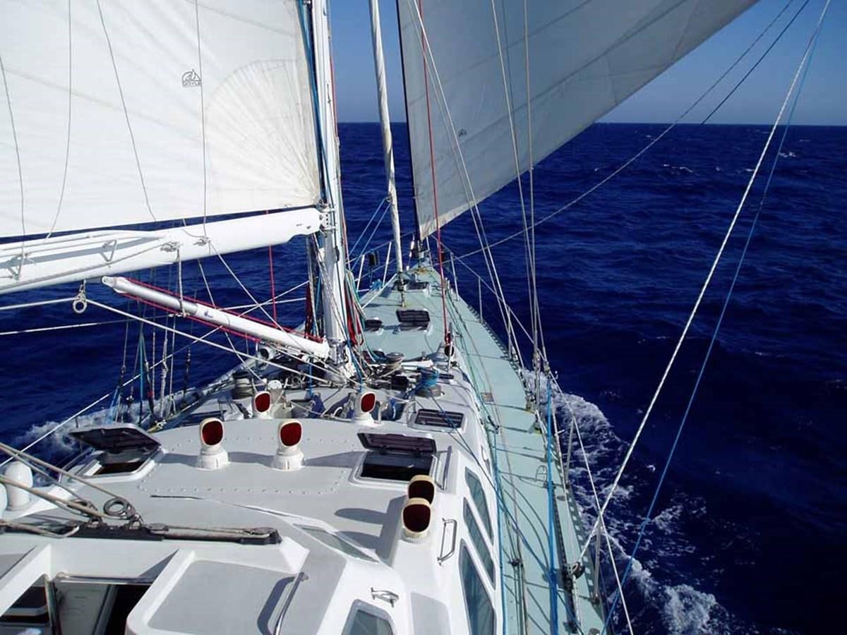 a sailboat on the water aboard SONG OF THE WHALE Yacht for Sale