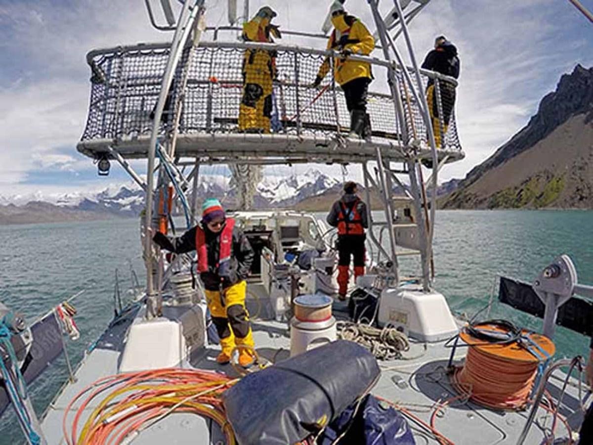 a group of men on a boat aboard SONG OF THE WHALE Yacht for Sale