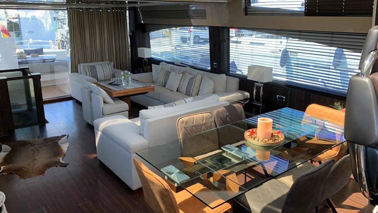 a living room with a large window aboard JAX OF IBIZA Yacht for Sale
