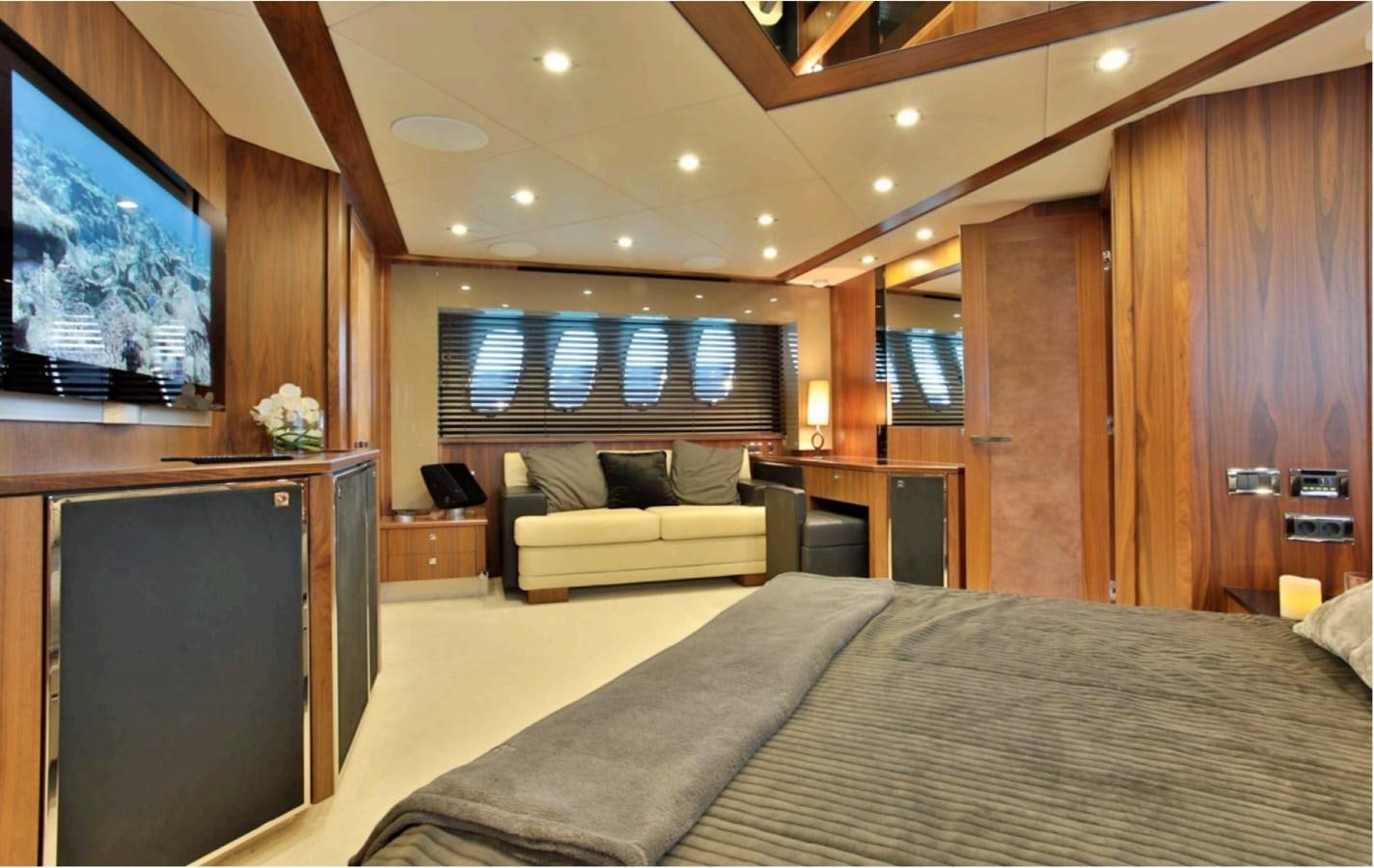 a bedroom with a bed and a tv aboard JAX OF IBIZA Yacht for Sale