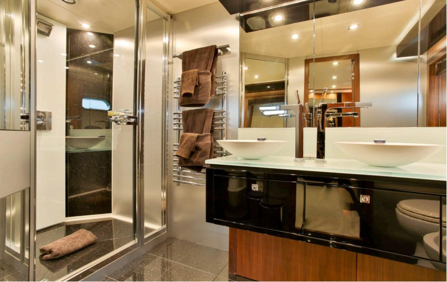 a bathroom with a large mirror aboard JAX OF IBIZA Yacht for Sale