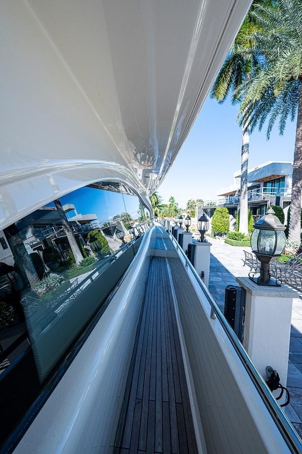 a black and white photo of a black table and a white tent aboard FERRETTI Yacht for Sale