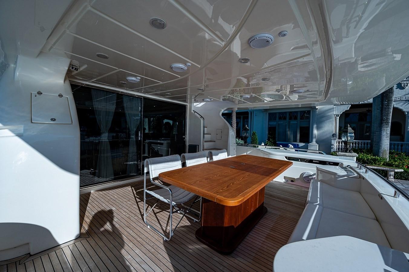 a room with a table and chairs aboard FERRETTI Yacht for Sale