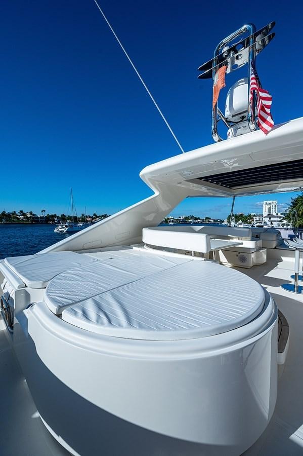 a boat with a flag on it aboard FERRETTI Yacht for Sale