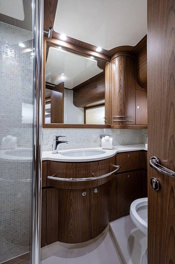 a bathroom with a sink and a mirror aboard FERRETTI Yacht for Sale