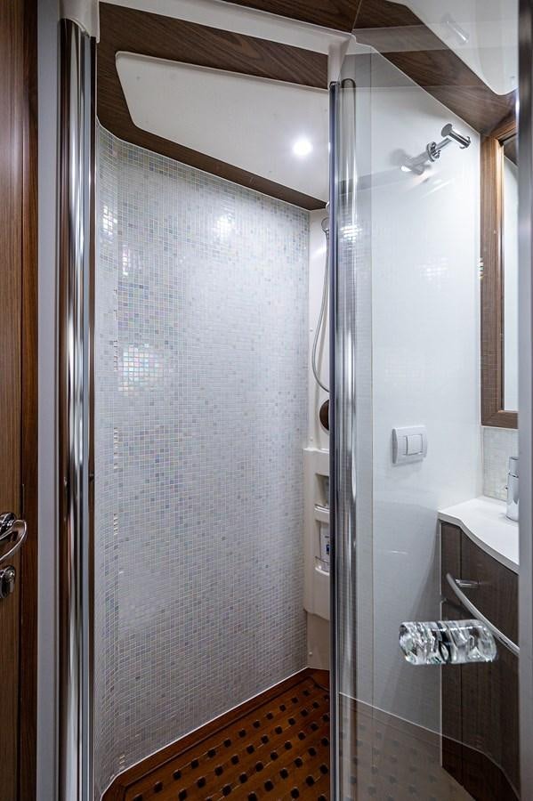 a shower unit in a bathroom aboard FERRETTI Yacht for Sale