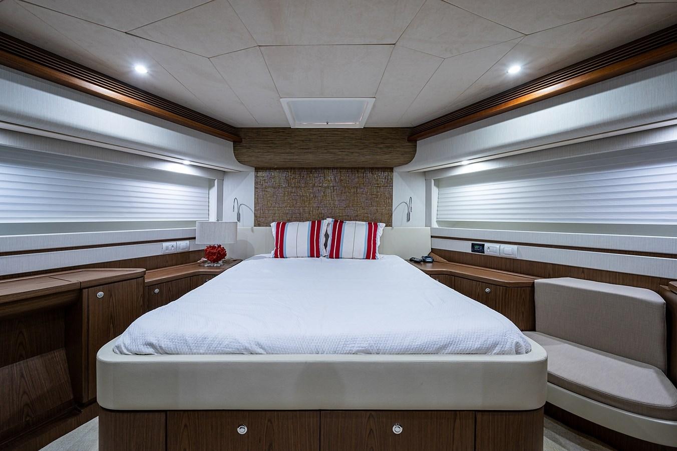 a room with a bed and a window aboard FERRETTI Yacht for Sale