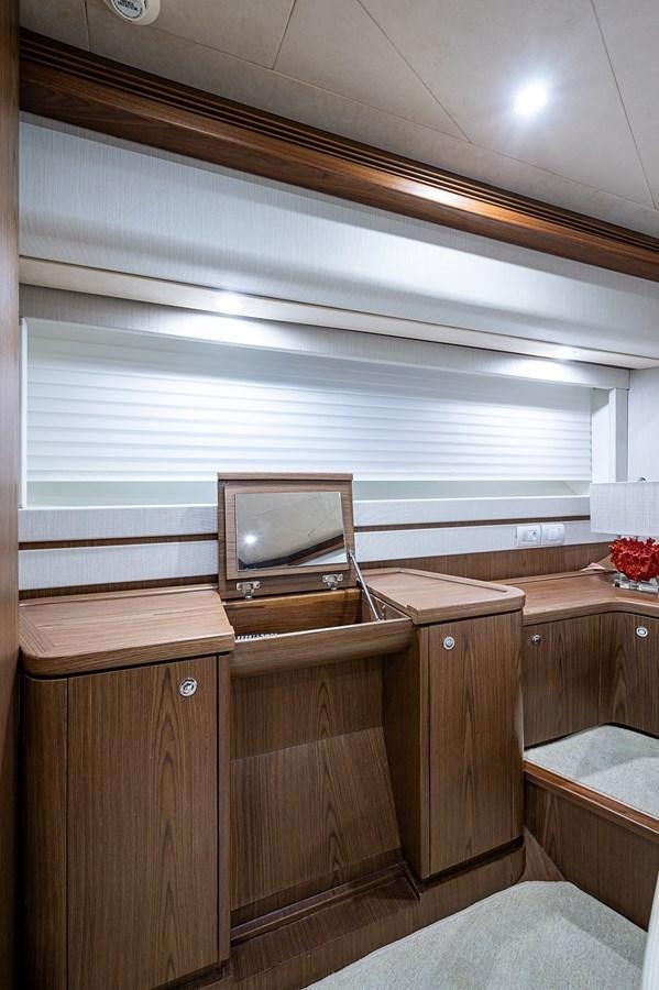 a tv on a dresser aboard FERRETTI Yacht for Sale