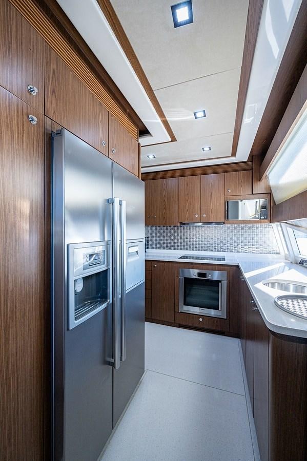 a kitchen with stainless steel appliances aboard FERRETTI Yacht for Sale
