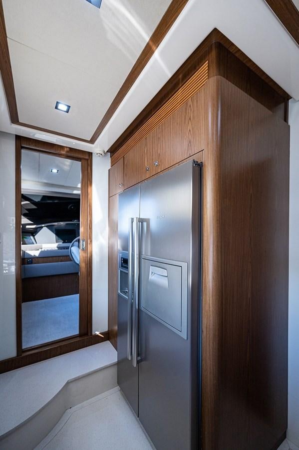 a room with a glass door and a window aboard FERRETTI Yacht for Sale