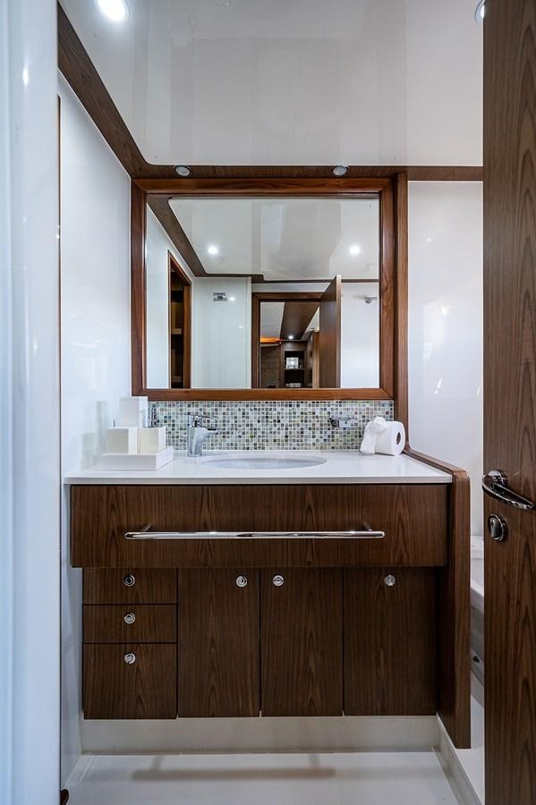 a bathroom with a large mirror aboard FERRETTI Yacht for Sale