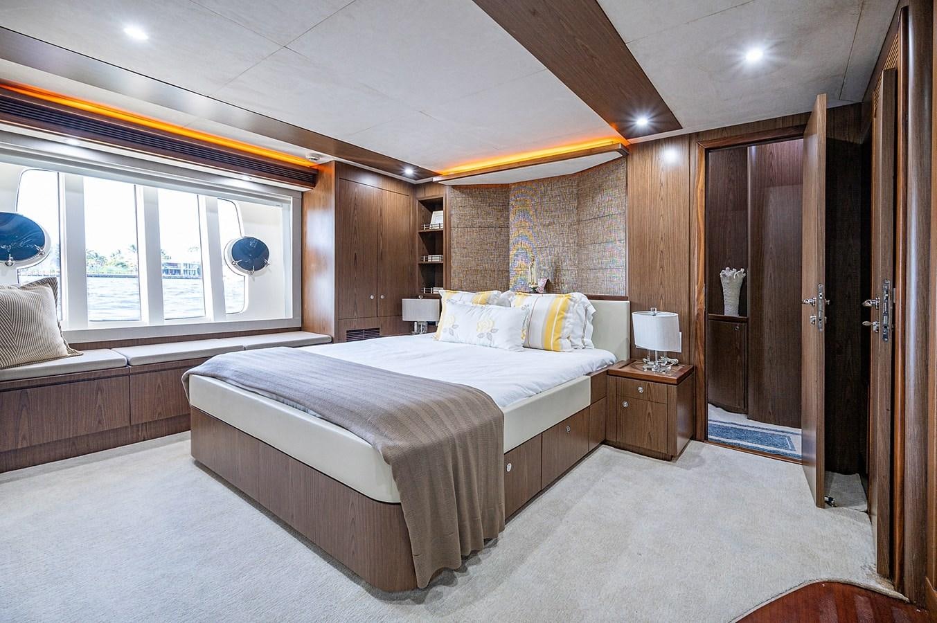 a large bedroom with a bed aboard FERRETTI Yacht for Sale
