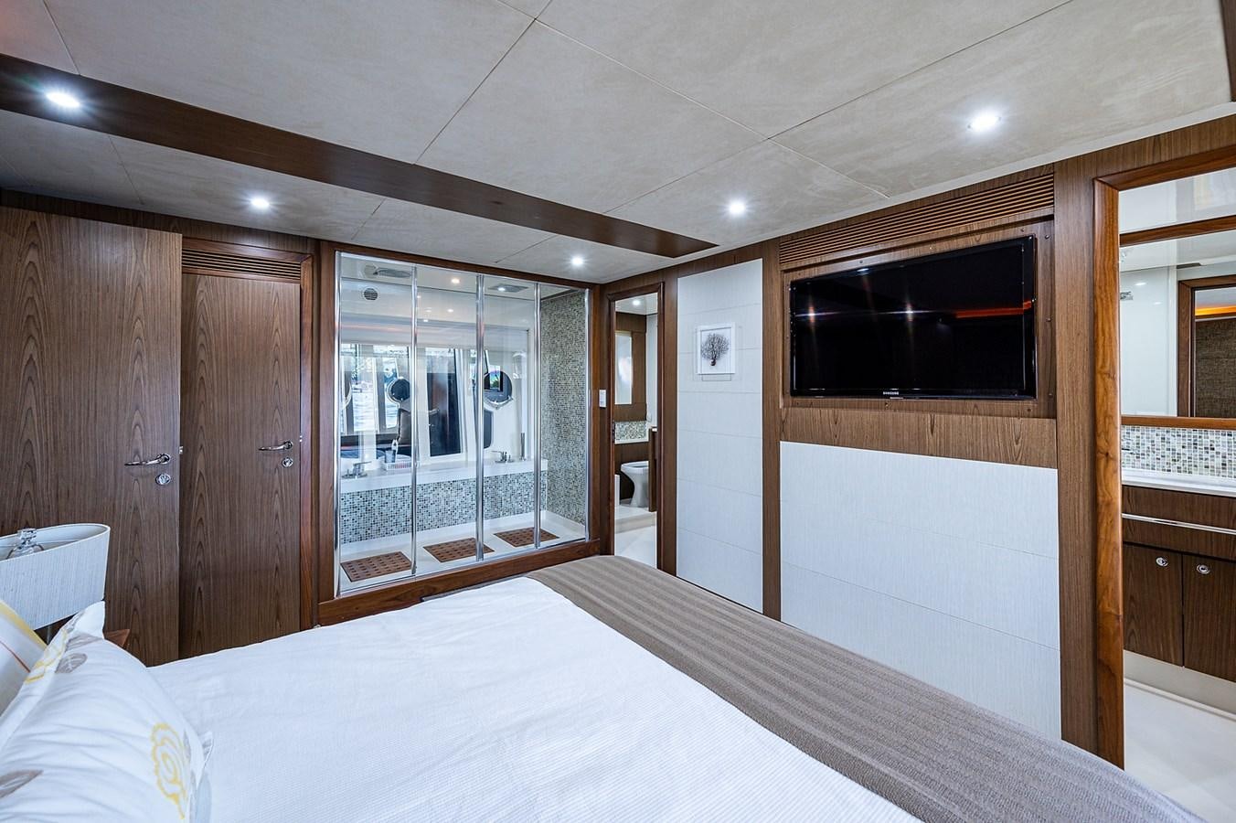 a large bedroom with a large bed aboard FERRETTI Yacht for Sale