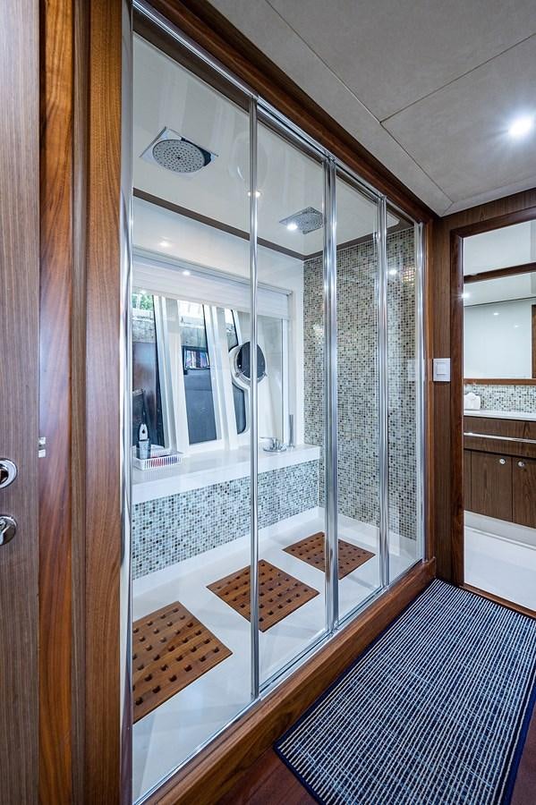 a glass shower unit in a bathroom aboard FERRETTI Yacht for Sale