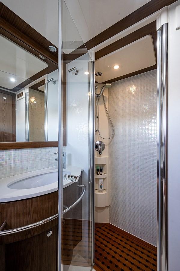 a bathroom with a shower unit and sink aboard FERRETTI Yacht for Sale