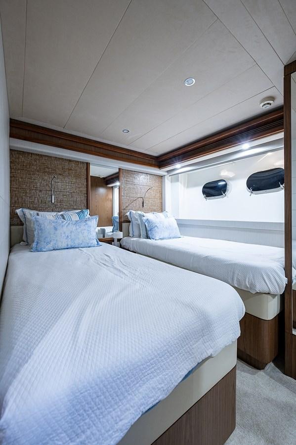 a couple of beds in a room aboard FERRETTI Yacht for Sale