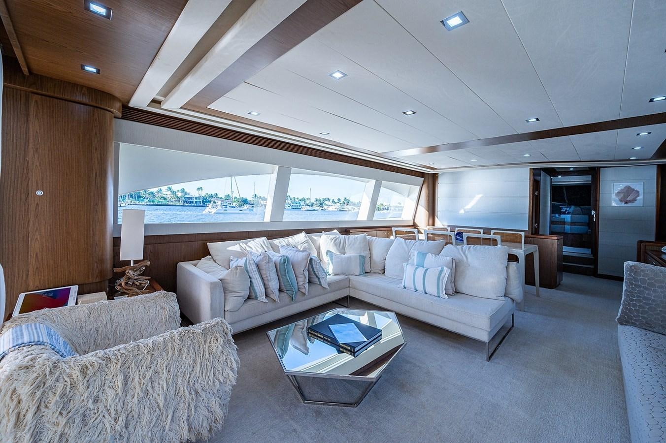 a living room with a couch and a table aboard FERRETTI Yacht for Sale